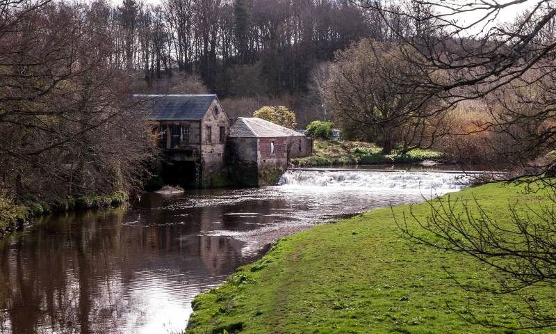 The River White Cart runs past the stables in Pollok Park, Glasgow.